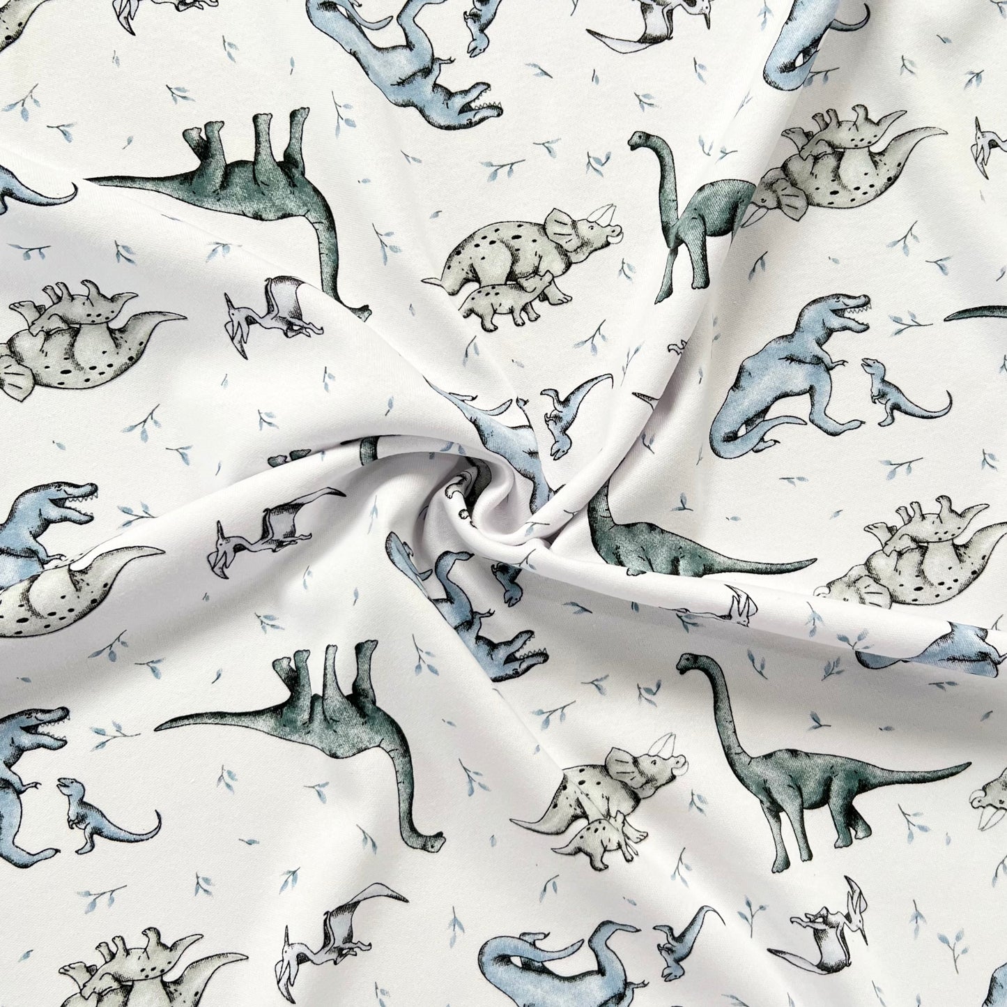 Interlock 30/1 Dinosaurios Blanco