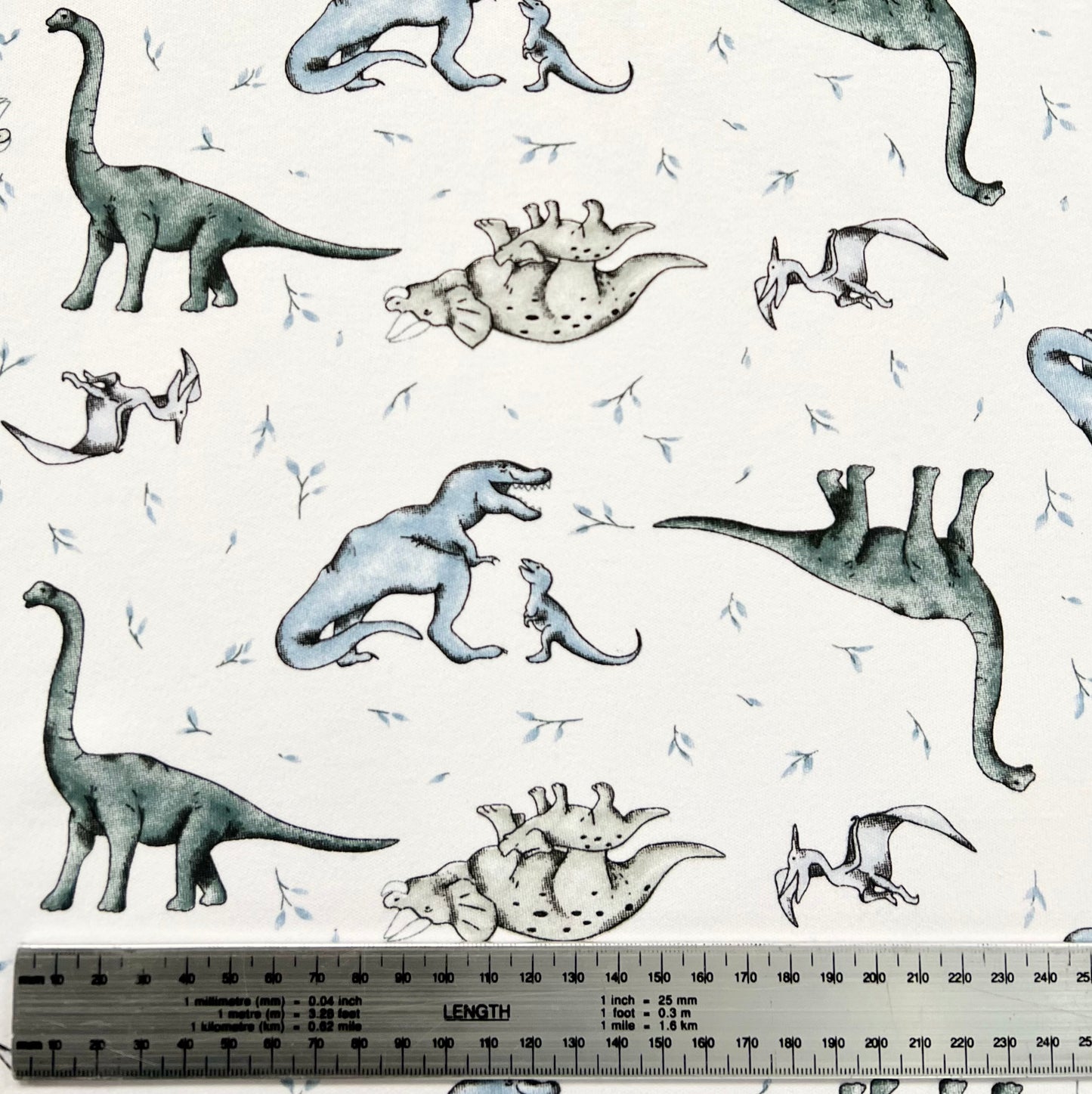 Interlock 30/1 Dinosaurios Blanco