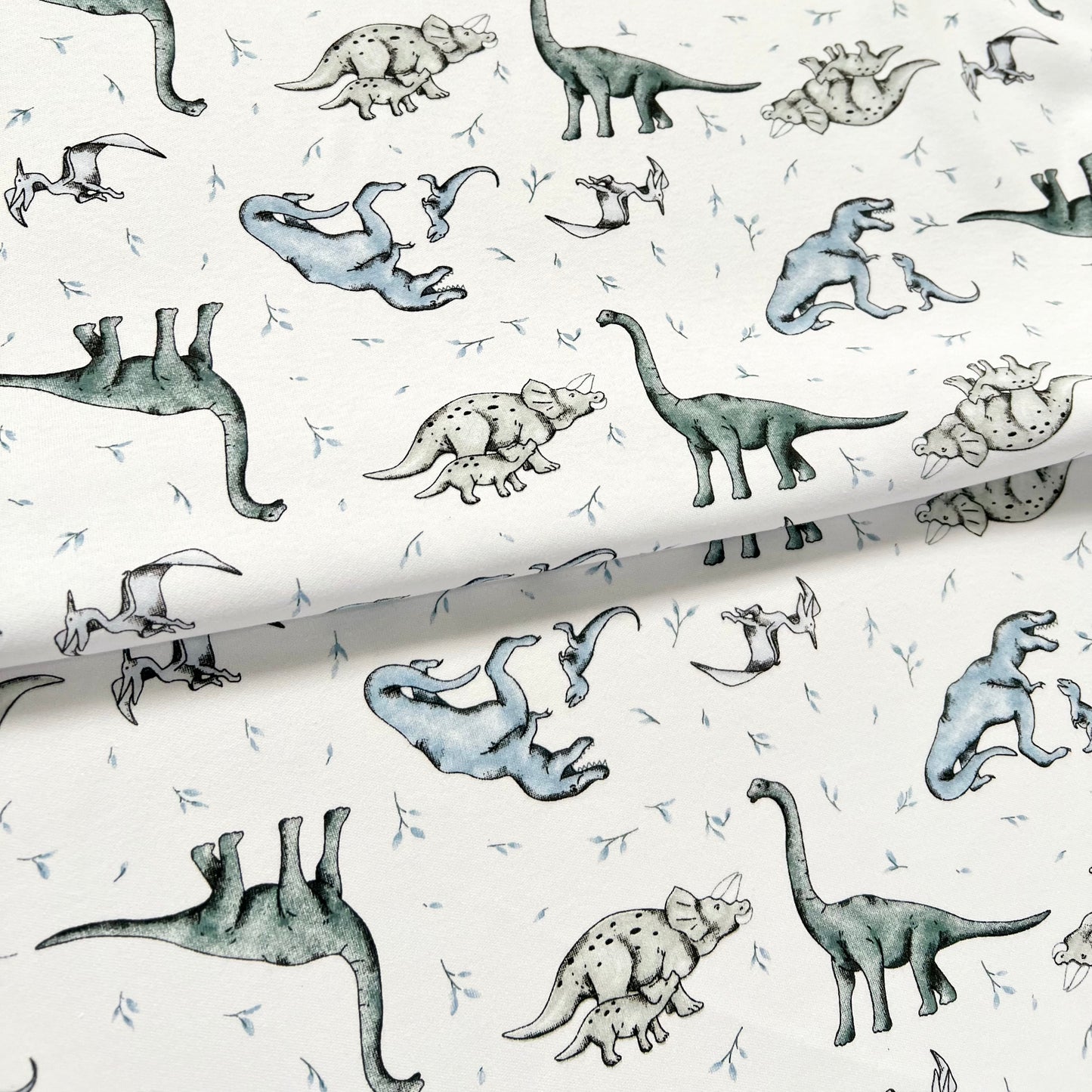 Interlock 30/1 Dinosaurios Blanco