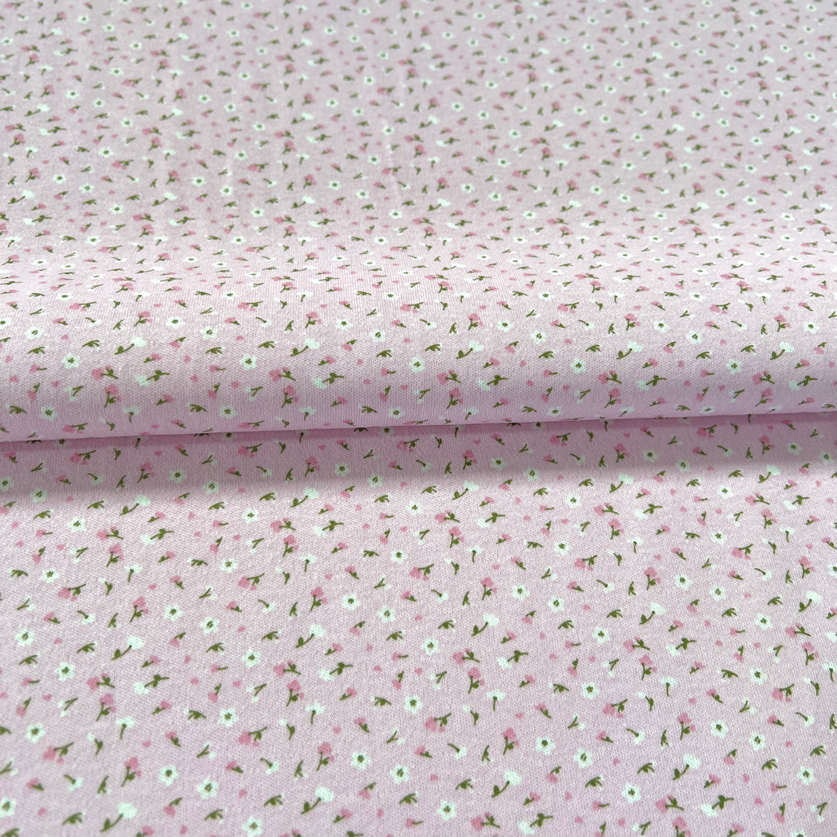 Jersey 30/1 Florcitas Fondo Rosa