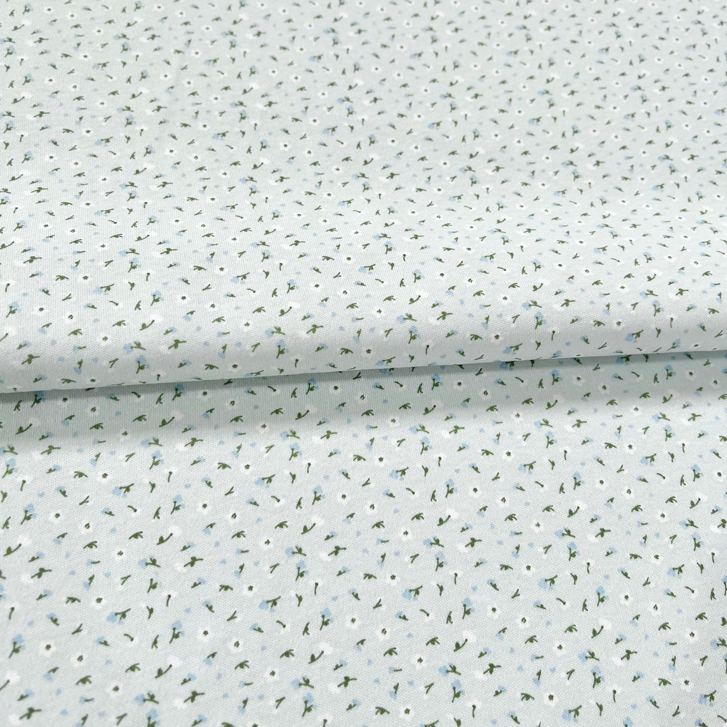 Interlock 30/1 Florcitas Fondo Celeste